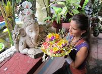 Canang offerings for Ganesha, the house and car